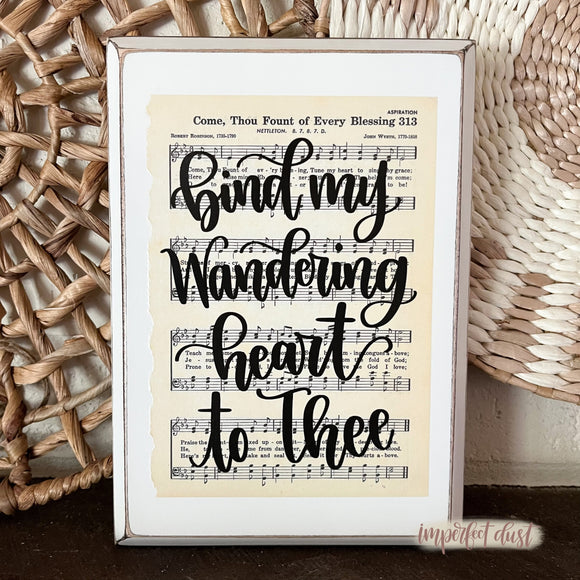 Come Thou Fount of Every Blessing hymn sign with the hand lettered lyrics of 